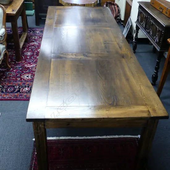 A fruitwood French provincial country style dining table