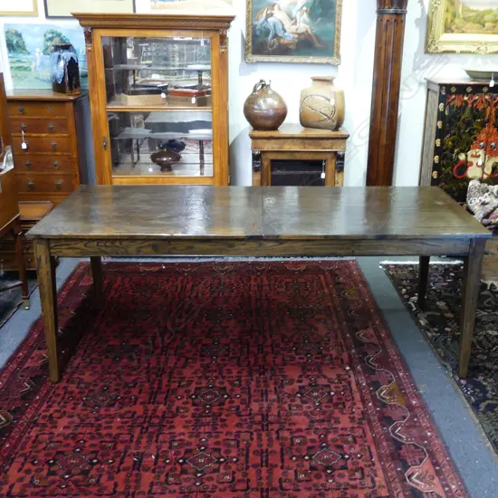 A modern French antique style oak refectory extension dining table