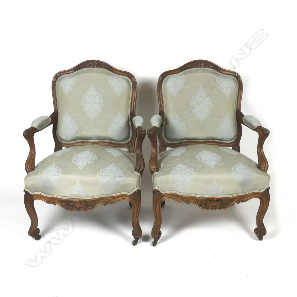 A pair of open elbow armchairs Image 1++