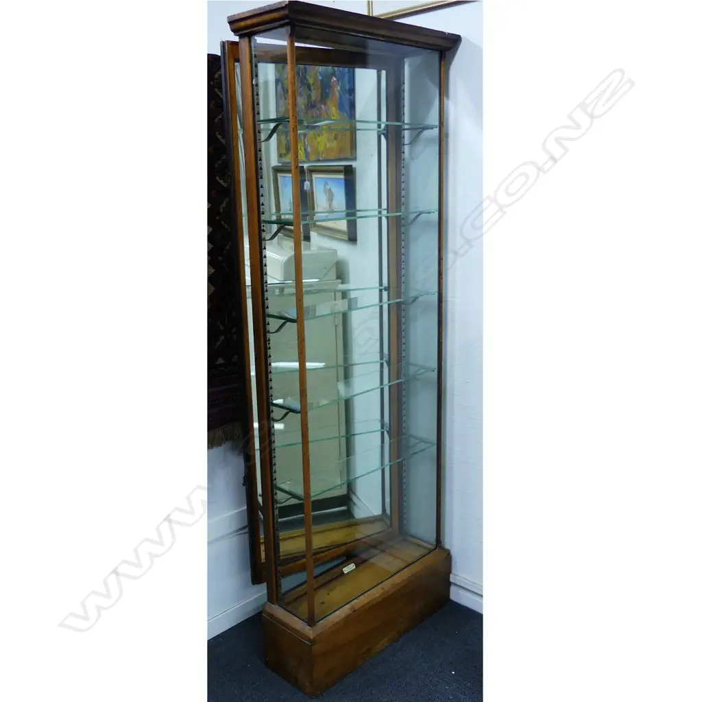 A good early 20thC oak 'Driller & Co. Makers Wellington' tall narrow shop display cabinet Image 1++