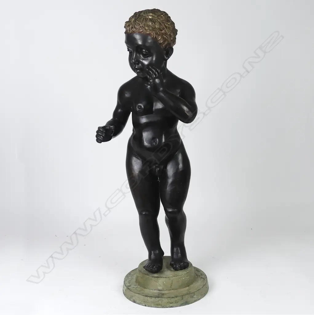 A bronze statue of a cherub Image 1++