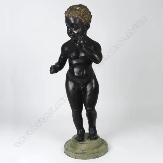 A bronze statue of a cherub
