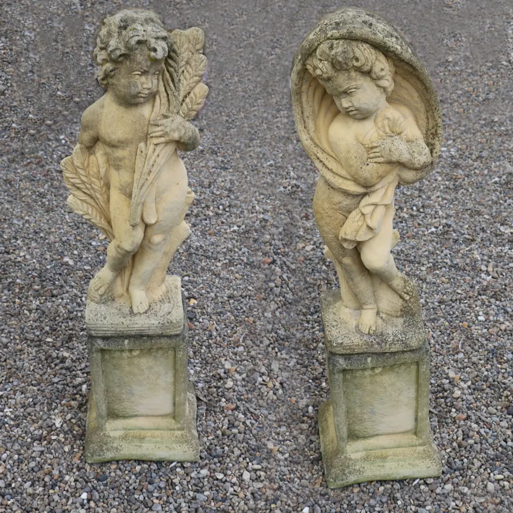 A pair of Church Stone garden statues on plinths Image 1++