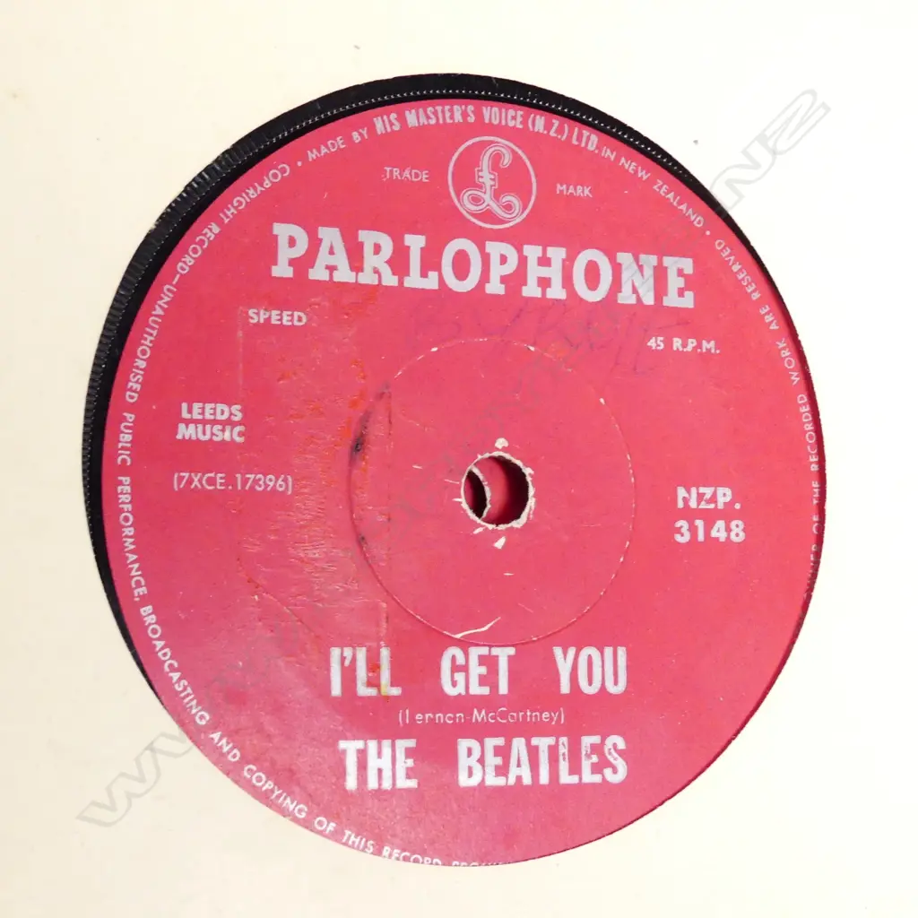 Record album with twelve early Beatles singles Image 1++