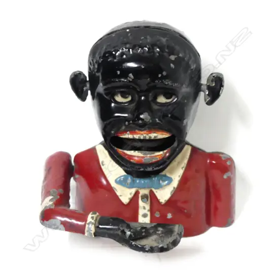 A vintage American aluminium ‘Greedy Boy’ money box