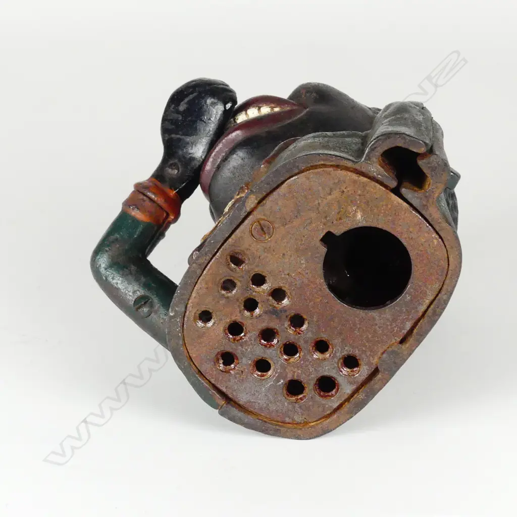 A cast iron 'Greedy Boy' money bank Image 1++