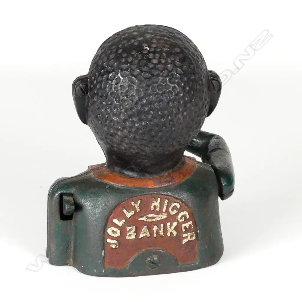 A cast iron 'Greedy Boy' money bank Image 1++