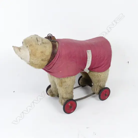 A vintage plush toy pull-along bear