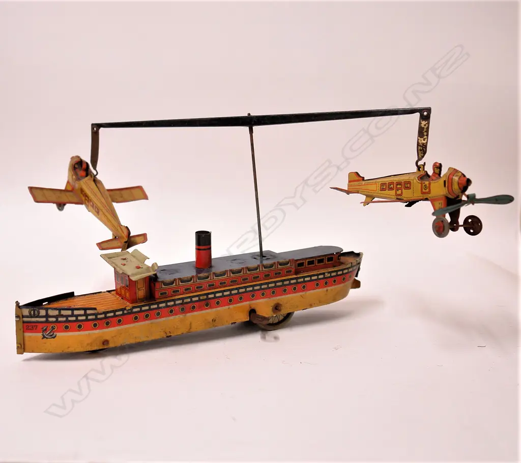 An early 20thC German Kellerman tin plate ship and plane merry-go-round toy Image 1++