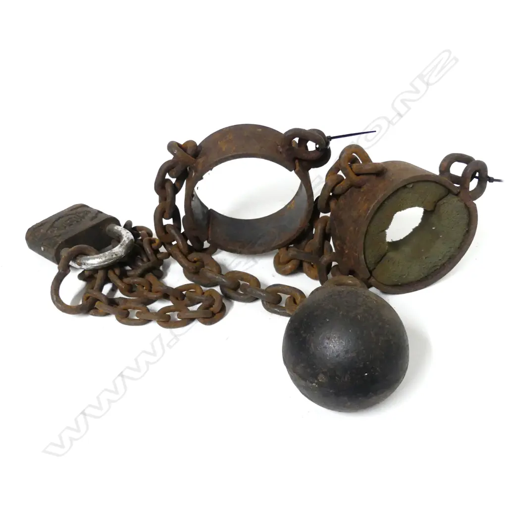 A convict's leg irons and ball with chain links Image 1++