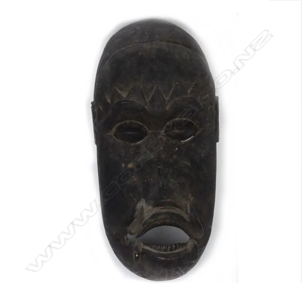 A vintage tribal carved wooden mask Image 1++