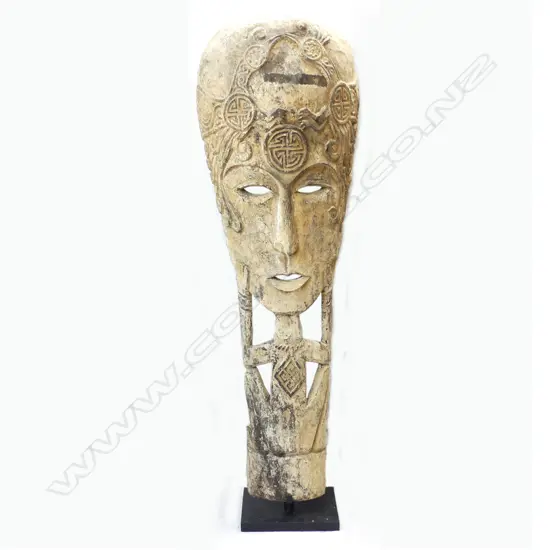 An Indonesian large stylised carved figure
