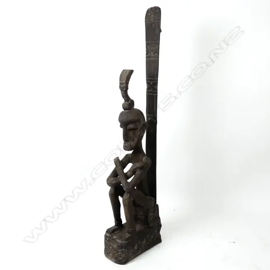 An Indonesian large craved wood seated figure