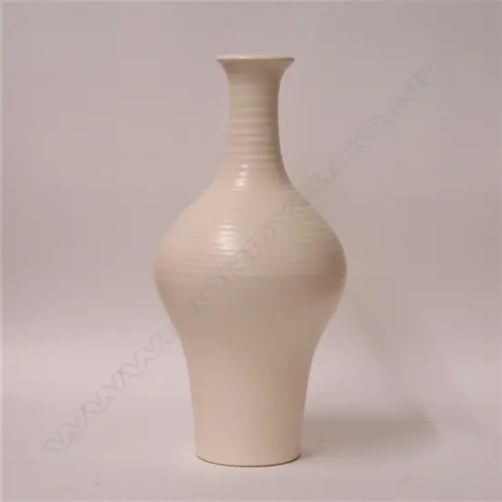 A rare Hand Potted Crown Lynn bottle form vase