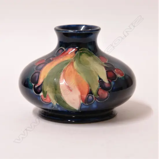A Walter Moorcroft ‘Leaf and Berry’ pattern vase