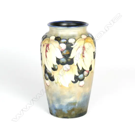 An uncommon Walter Moorcroft 'Leaf and Berry' salt glazed vase