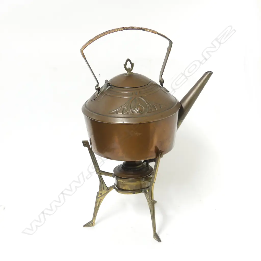 An Arts & Crafts copper spirit kettle on brass stand Image 1++
