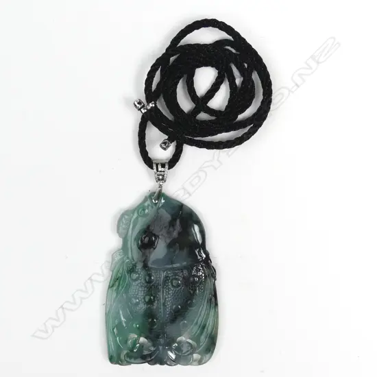 A Chinese carved jadeite large pendant