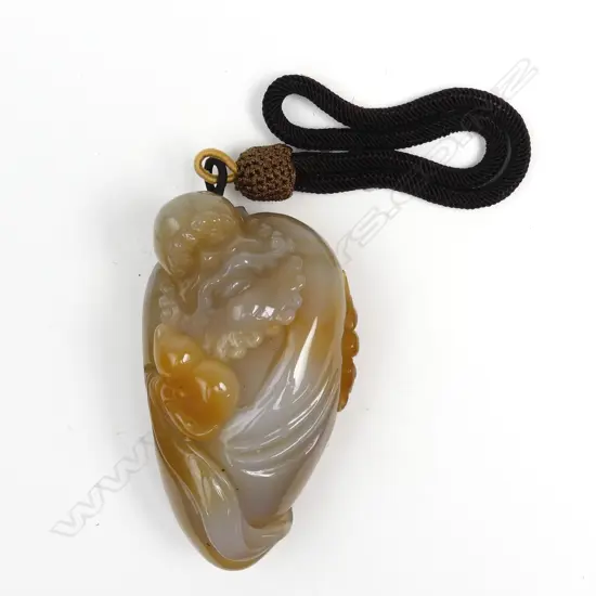 A Chinese carved agate large pendant