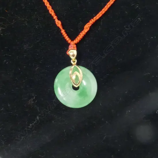 A small Chinese jade bi disc pendant