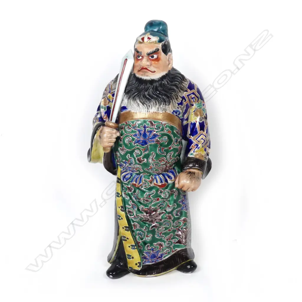 A Chinese porcelain figure of a standing warrior god Image 1++
