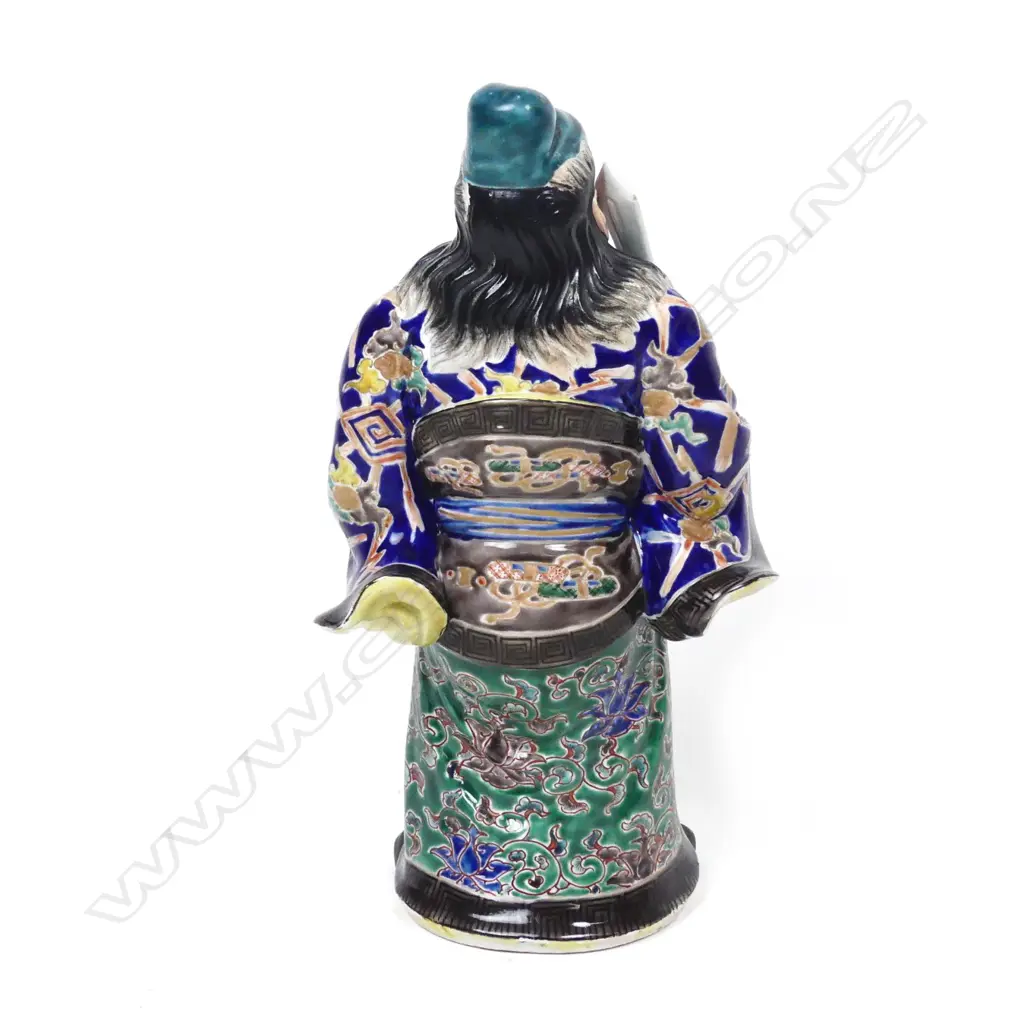 A Chinese porcelain figure of a standing warrior god Image 1++