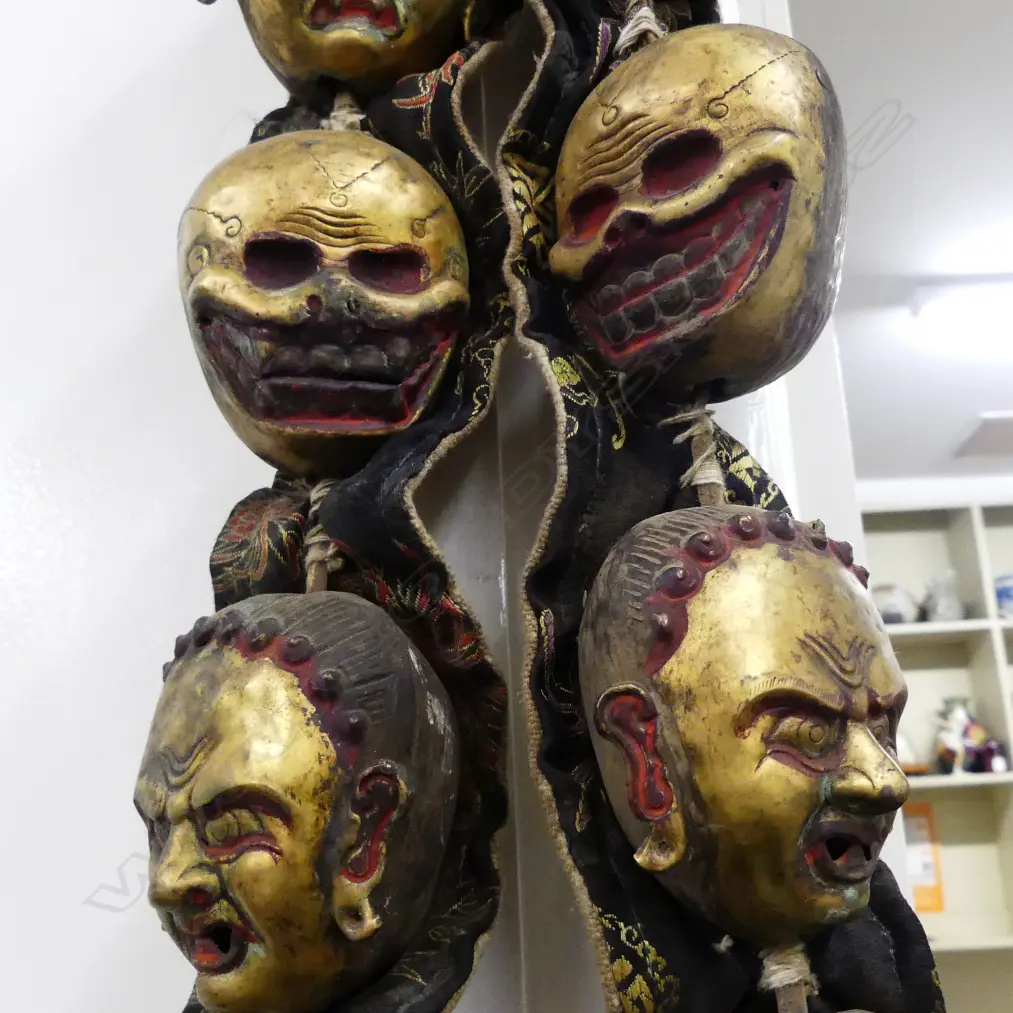 An uncommon Tibetan lama’s collar of thirteen brass masks Image 1++