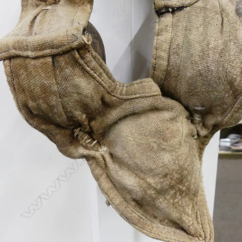 An uncommon Tibetan lama’s collar of thirteen brass masks Image 1++