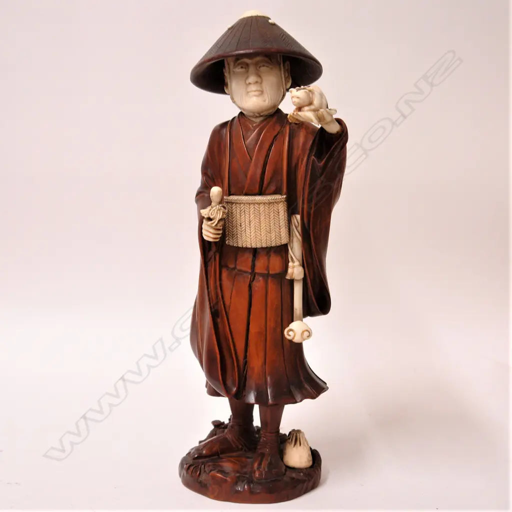 A good old Japanese carved boxwood and ivory large figure of a puppy seller Image 1++