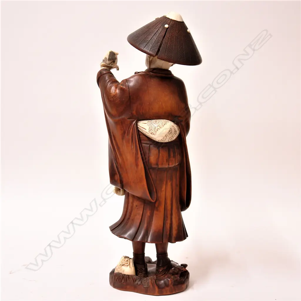 A good old Japanese carved boxwood and ivory large figure of a puppy seller Image 1++