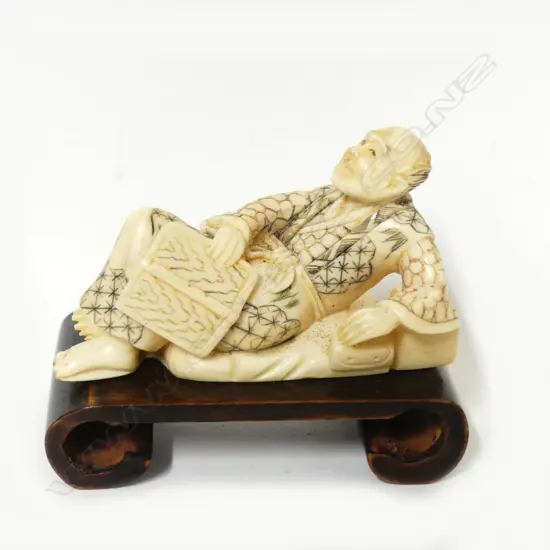 A Japanese ivory okimono