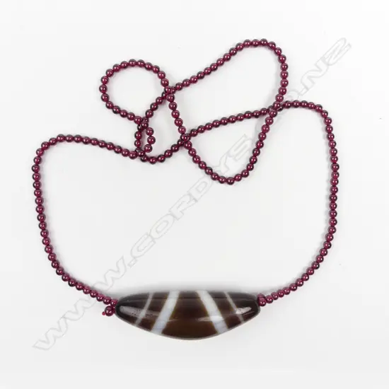 A banded agate large bead on garnet bead necklace