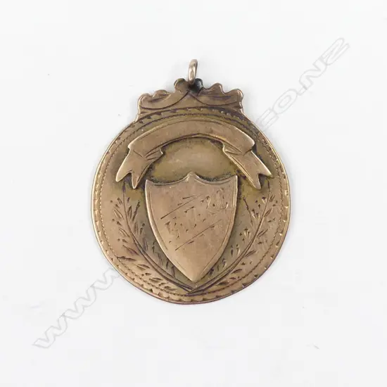 An early 1900 rose gold medal