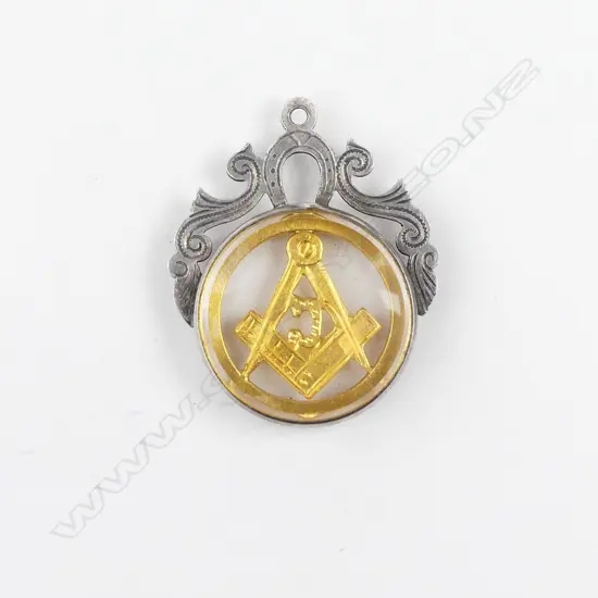 A silver and gold Masonic pendant