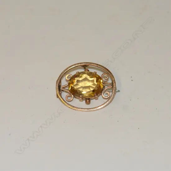 An Edwardian 9ct. rose gold and citrine brooch