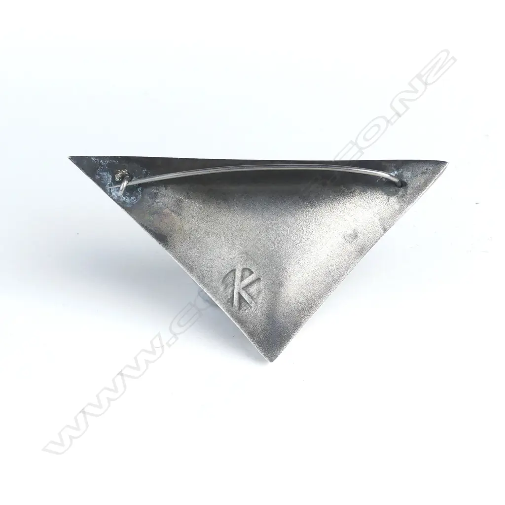 A modernist triangular puff form brooch Image 1++