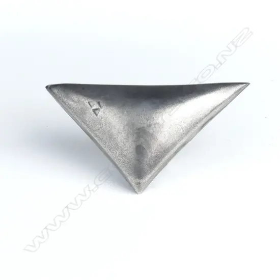 A modernist triangular puff form brooch
