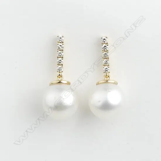A pair of 14ct gold pearl and diamond drop earrings