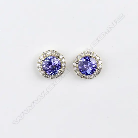 A pair of 14ct. gold tanzanite and diamond stud earrings