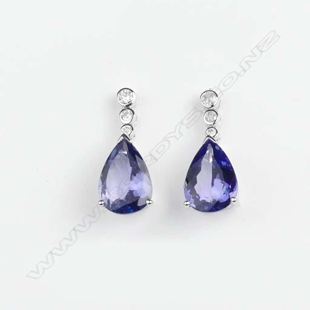 A pair of 14ct white gold tanzanite and diamond drop earrings Image 1++