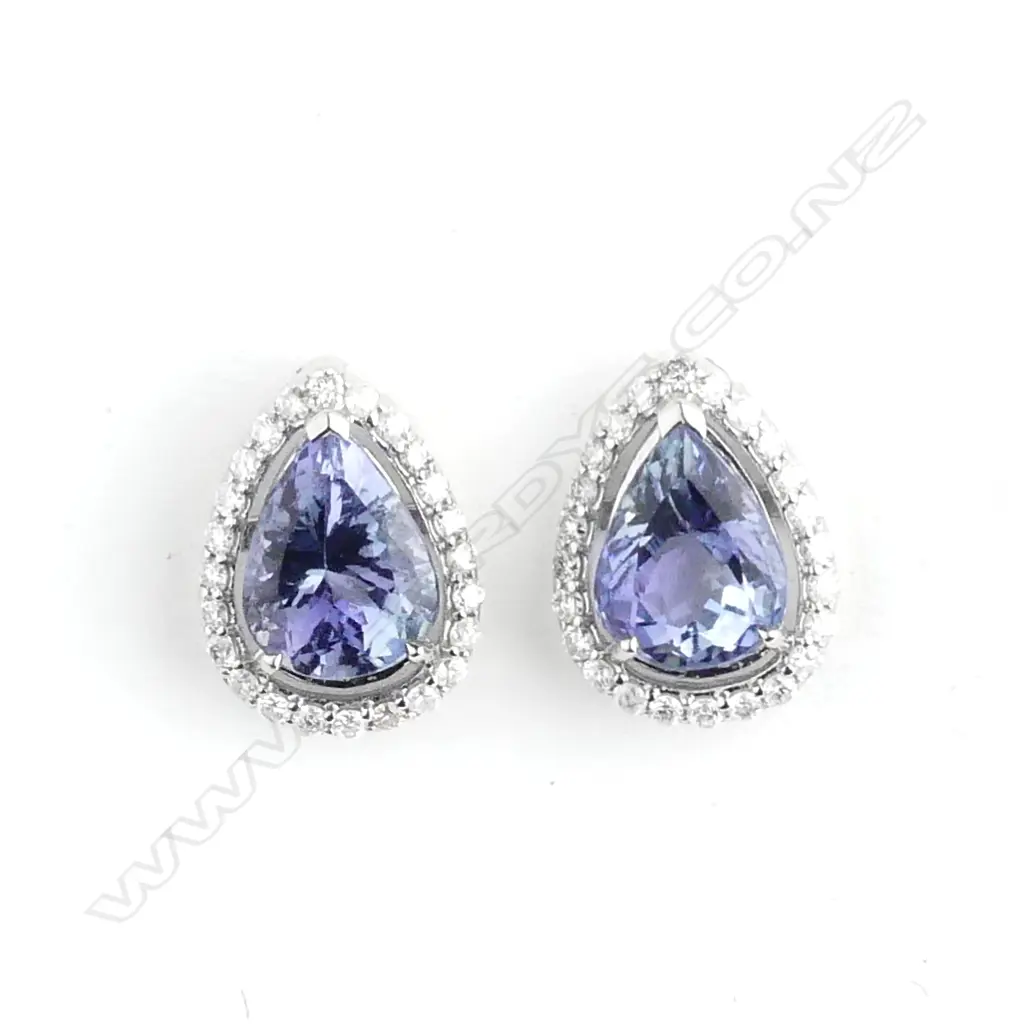 A pair of 14ct white gold sapphire and diamond earrings Image 1++