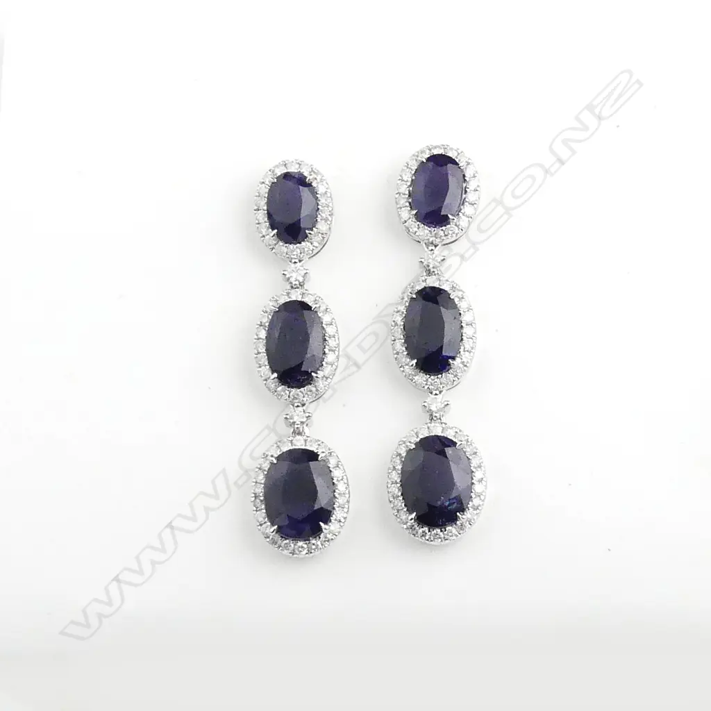 A pair of 18ct white gold sapphire and diamond earrings Image 1++