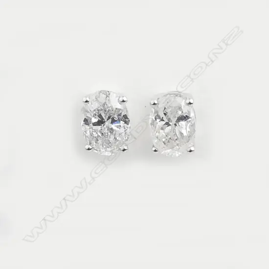 A pair of 14ct white gold and diamond stud earrings