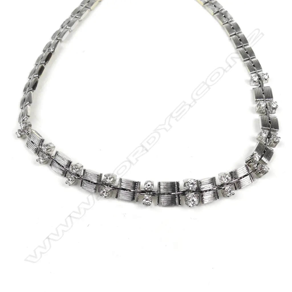 An 18ct white gold and diamond necklace Image 1++