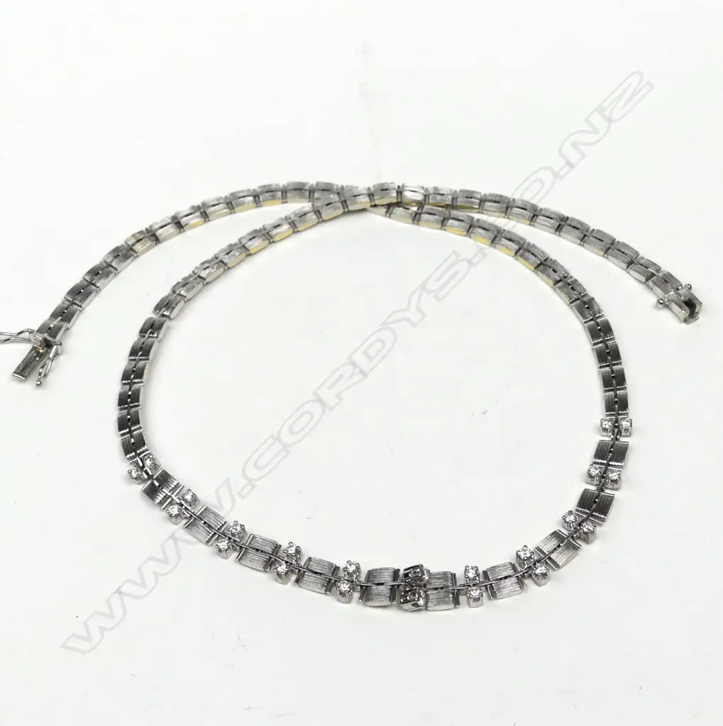 An 18ct white gold and diamond necklace Image 1++