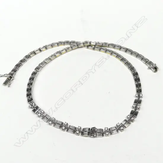 An 18ct white gold and diamond necklace