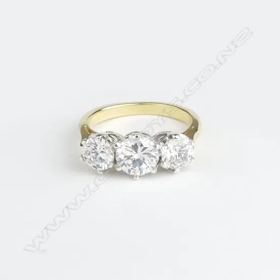An 18ct gold three stone diamond ring