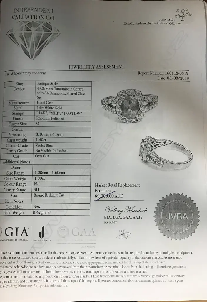 A 14ct white gold tanzanite and diamond ring Image 1++