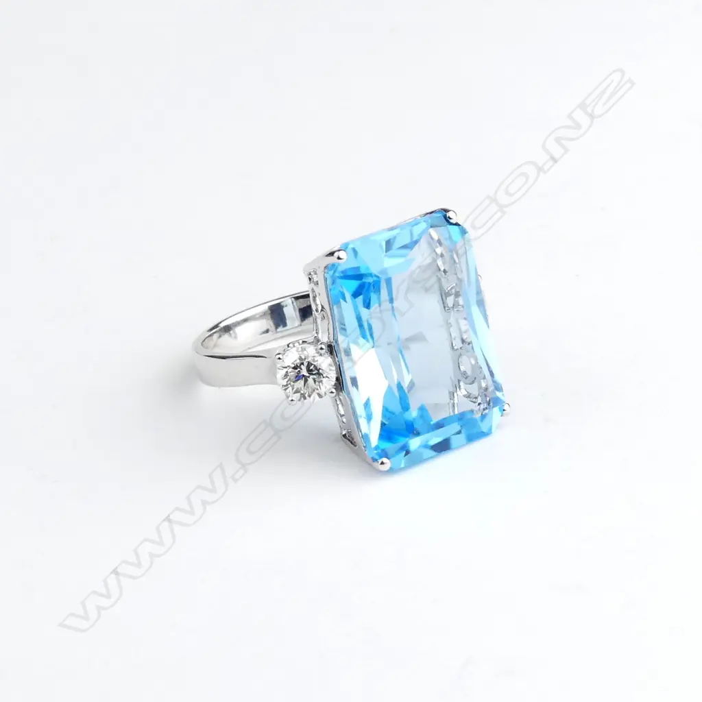 A 14ct white gold blue topaz and diamond ring Image 1++