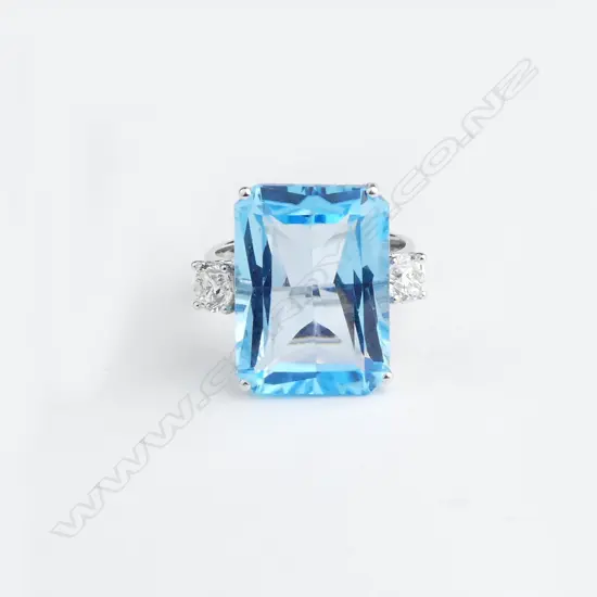 A 14ct white gold blue topaz and diamond ring